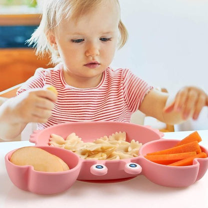 Assiette bébé rose remplie  de nourritures