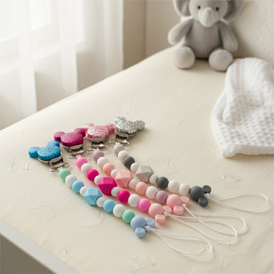 attache tetine 4 couleurs brillant