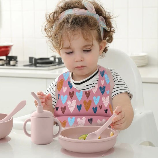Bavoir bébé avec-fille-qui-mange