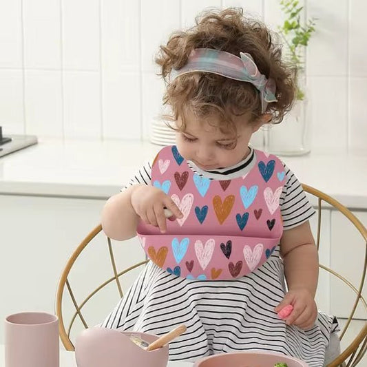 Bavoir bébé rose avec motif 