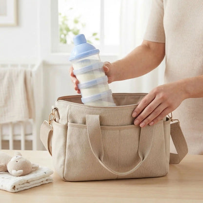 boite doseuse lait dans un sac à  langer