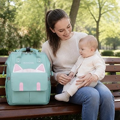 sac a langer couleur vert sur chaise